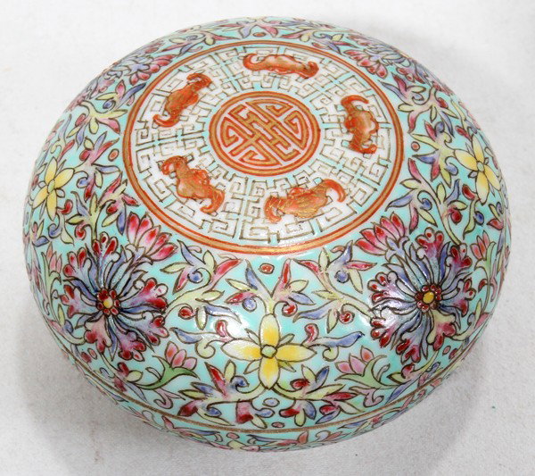 CHINESE FAMILLE ROSE PORCELAIN COVERED INK BOX: CHINESE FAMILLE ROSE PORCELAIN COVERED INK BOX, H 2", DIA 3":Multi colored flowers and bats with long life symbol. Stamped on underside.