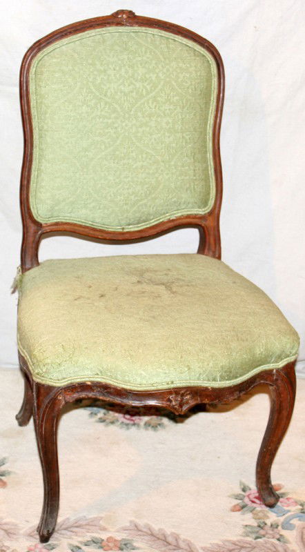 LOUIS XV FRENCH 18TH C. WALNUT SIDE CHAIR: LOUIS XV FRENCH 18TH C. WALNUT SIDE CHAIR:Hand carved frame. Spring style upholstered seat and inset upholstered back panel. Curved legs, Louis XV. H 36" W 19" serpentine seat. Peg condition, some ind