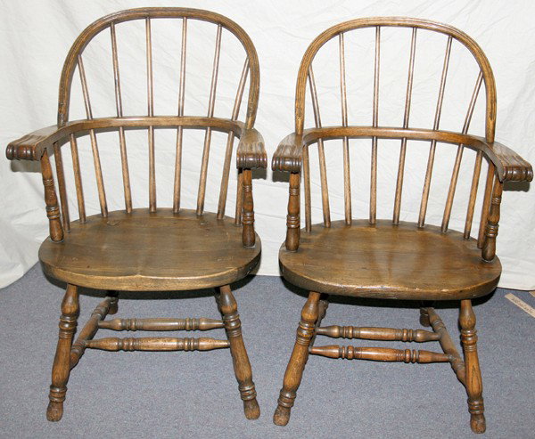 ENGLISH OAK BOW-BACK WINDSOR ARMCHAIRS, ANTIQUE: ENGLISH OAK BOW-BACK WINDSOR ARMCHAIRS, ANTIQUE, PAIR:Of mixed woods, each having a bowed crest rail above six spindles and encircling knuckle arms, carved saddle seat raised on turned supports joined