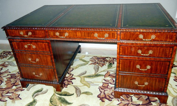 MAITLAND SMITH MAHOGANY PARTNERS DESK: MAITLAND SMITH MAHOGANY PARTNERS DESK:62" x 36"; carved design surround, three drawers on each side, three top drawers, tooled leather green top in three sections. With brass pulls.