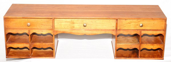 STICKLEY CHERRY DESK TOP LETTER HOLDER H 9 1/2": STICKLEY CHERRY DESK TOP LETTER HOLDER, H 9 1/2", L 33", D 10":Having three drawers across the top above eight mail cubicles, four on each side with an opening in the center;