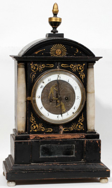 GERMAN WOOD & ONYX AUTOMATON MANTEL CLOCK,: GERMAN EBONIZED WOOD & ONYX AUTOMATON MANTEL CLOCK, C. 1800, H 17", W 10":Brass face mounted with a man and woman sawing automaton; mirrored tablet; onyx flanking columns. As is condition.