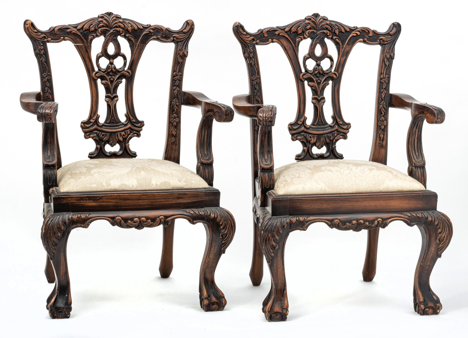 CHIPPENDALE STYLE CARVED WOOD CHILD'S ARMCHAIRS, 20TH C., PAIR, H 24.5", W 16.5", D 14.5": CHIPPENDALE STYLE CARVED WOOD CHILD'S ARMCHAIRS, 20TH C., PAIR, H 24.5", W 16.5", D 14.5" Having carved scrolling floral designs with ball and claw feet. Tan damask upholstery. Provenance: Property of