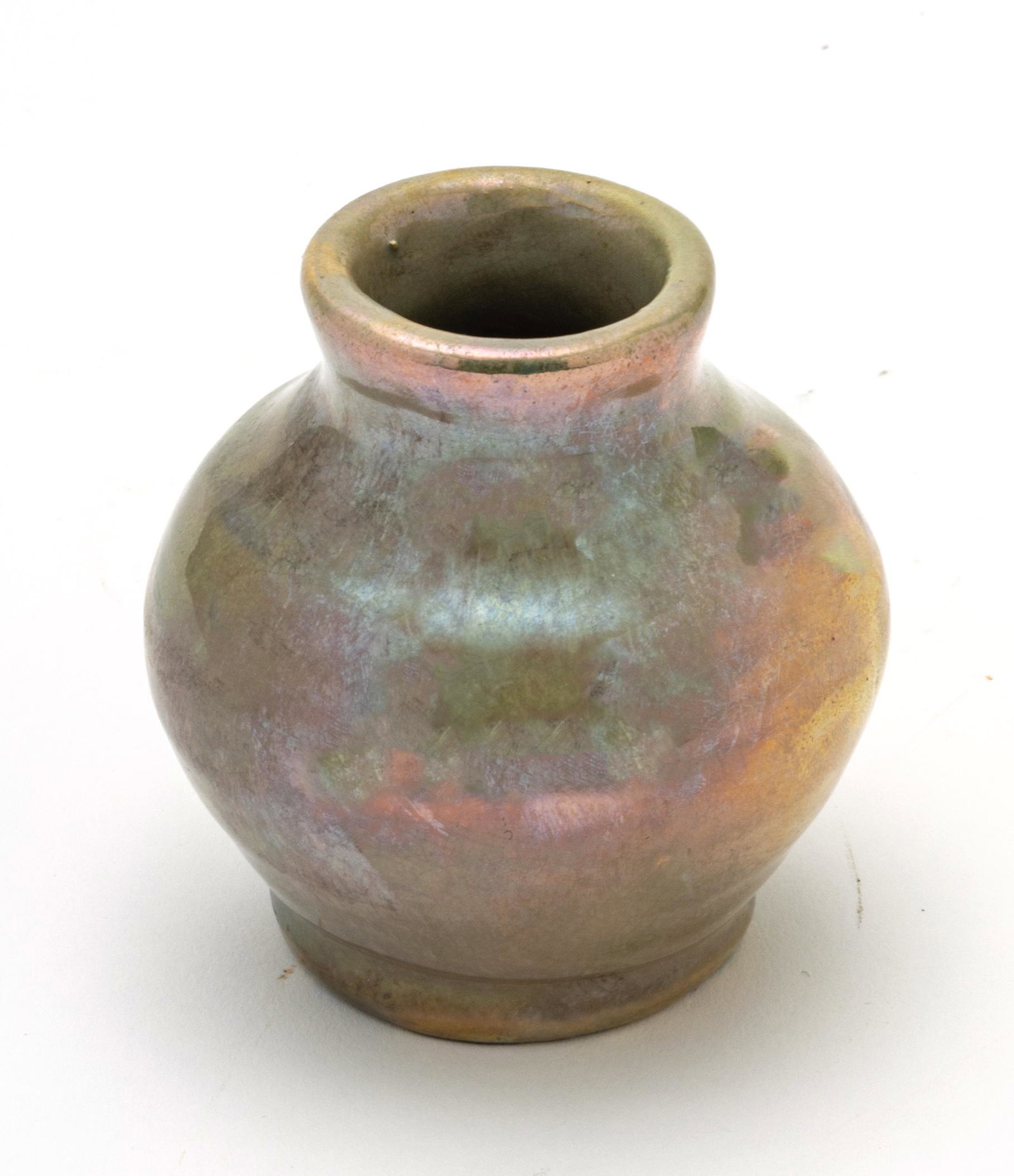 PEWABIC POTTERY IRIDESCENT GLAZE POTTERY VASE, C. 1930 H 3.5" DIA 3.5": PEWABIC POTTERY IRIDESCENT GLAZE POTTERY VASE, C. 1930 H 3.5" DIA 3.5" Copper iridescent glaze with reduction. Having early Pewabic Pottery paper label in black ink with impressed Pewabic Pottery "PP"