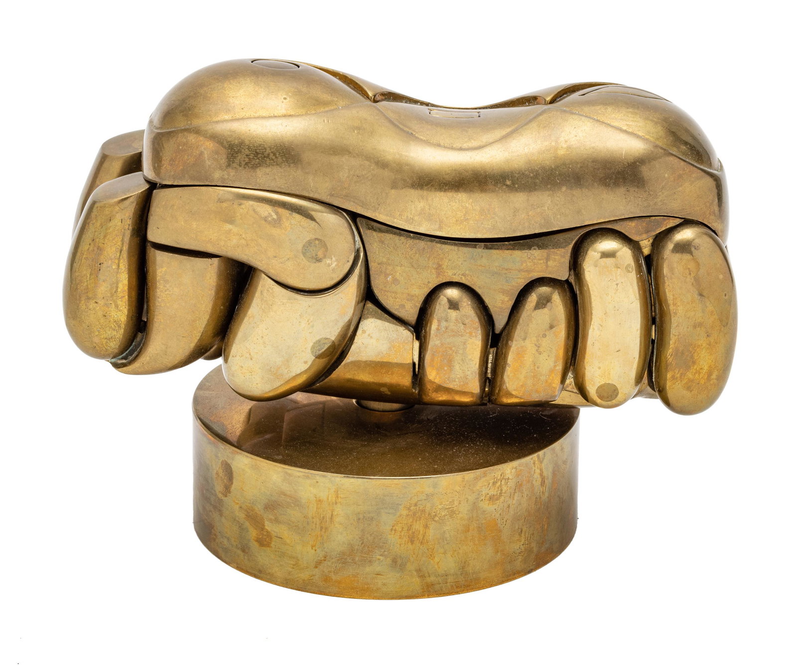 MIGUEL ORTIZ BERROCAL (SPAIN 1933-2006) BRASS PUZZLE SCULPTURE, 1967, H 6", L 8", "ROMEO E: MIGUEL ORTIZ BERROCAL (SPAIN 1933-2006) BRASS PUZZLE SCULPTURE, 1967, H 6", L 8", "ROMEO E GIULIETTA" A 1967 polished brass puzzle sculpture titled "Romeo E Giulietta". Presented on a rotating disc fo