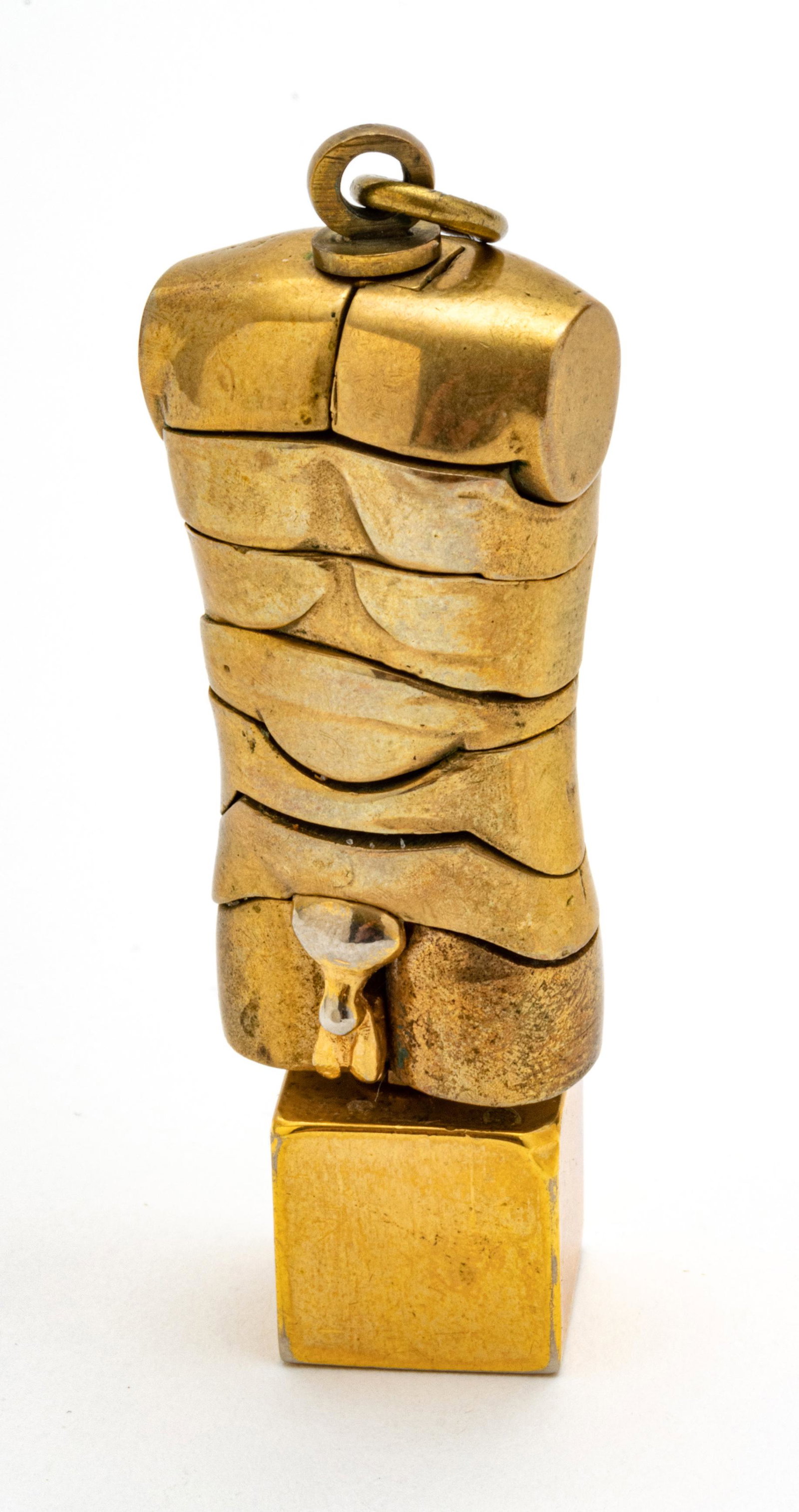 MIGUEL ORTIZ BERROCAL (SPAIN 1933-2006) BRASS PUZZLE SCULPTURE, 1971, H 2.25", "MICRO DAVID": MIGUEL ORTIZ BERROCAL (SPAIN 1933-2006) BRASS PUZZLE SCULPTURE, 1971, H 2.25", "MICRO DAVID" A 1971 brass puzzle sculpture titled "Micro David" by Miguel Ortiz Berrocal. Width 3/4", depth 1/2". Accomp