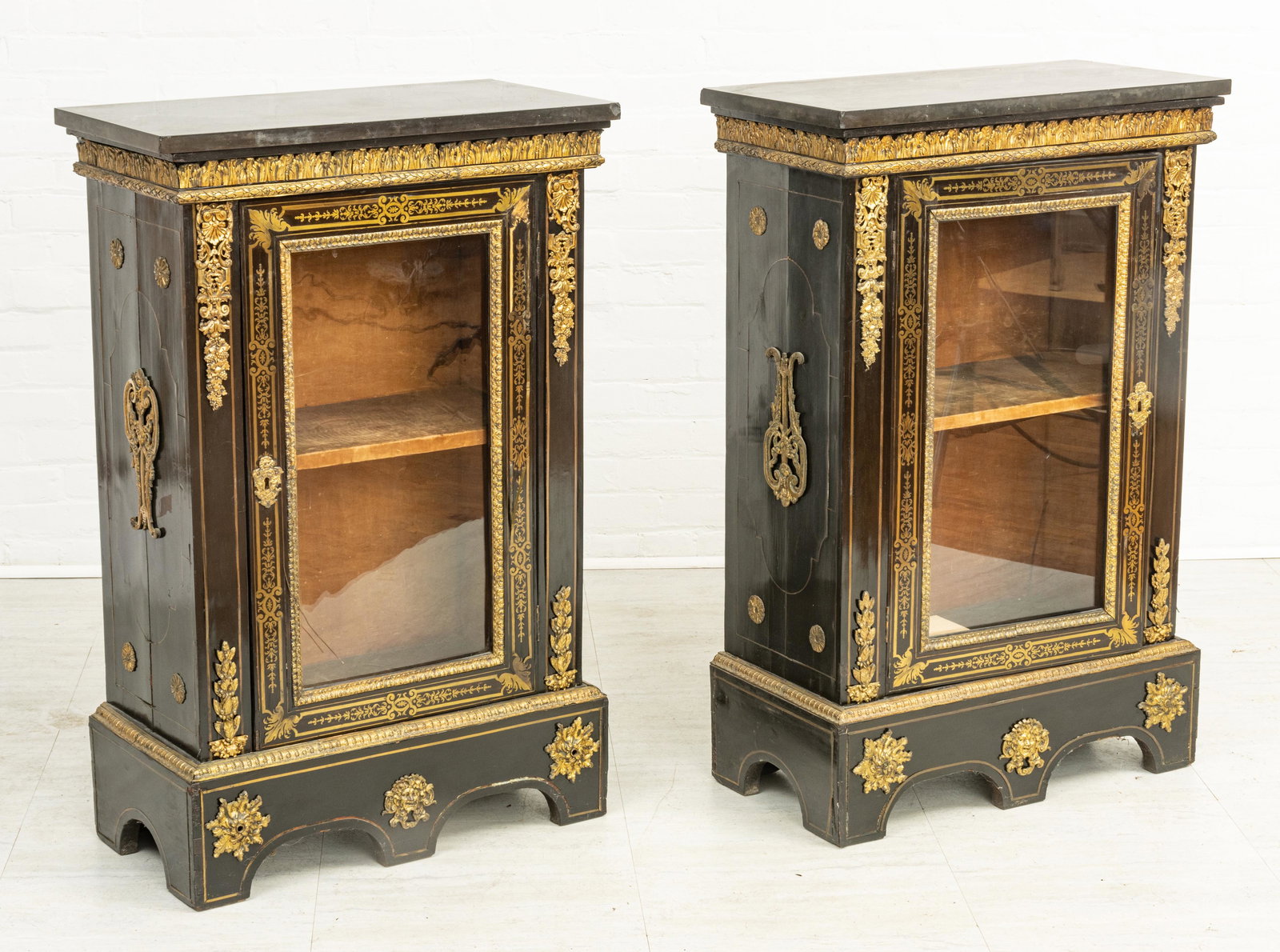 FRENCH BOULLE EBONIZED, ORMOLU MOUNTED & MARBLE TOP SIDE CABINETS, 19TH C, PAIR, H 43", W 28": FRENCH BOULLE EBONIZED, ORMOLU MOUNTED & MARBLE TOP SIDE CABINETS, 19TH C, PAIR, H 43", W 28" A pair of 19th century French cabinets or vitrines. Offers ebonized wood accented with ormolu, brass inlay