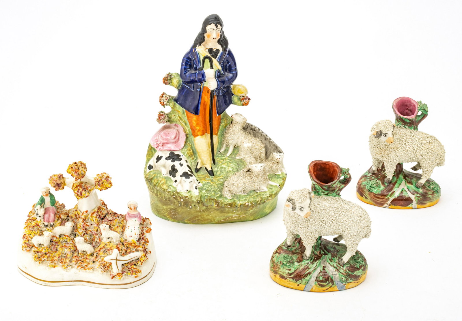 STAFFORDSHIRE EARTHENWARE FIGURINES, 19TH C, 4 PCS, H 4.5"-9.5", SHEPHERD & SHEEP: STAFFORDSHIRE EARTHENWARE FIGURINES, 19TH C, 4 PCS, H 4.5"-9.5", SHEPHERD & SHEEP A collection of four 19th century Staffordshire earthenware figurines. Each boasting a shepherd or sheep motif. From a