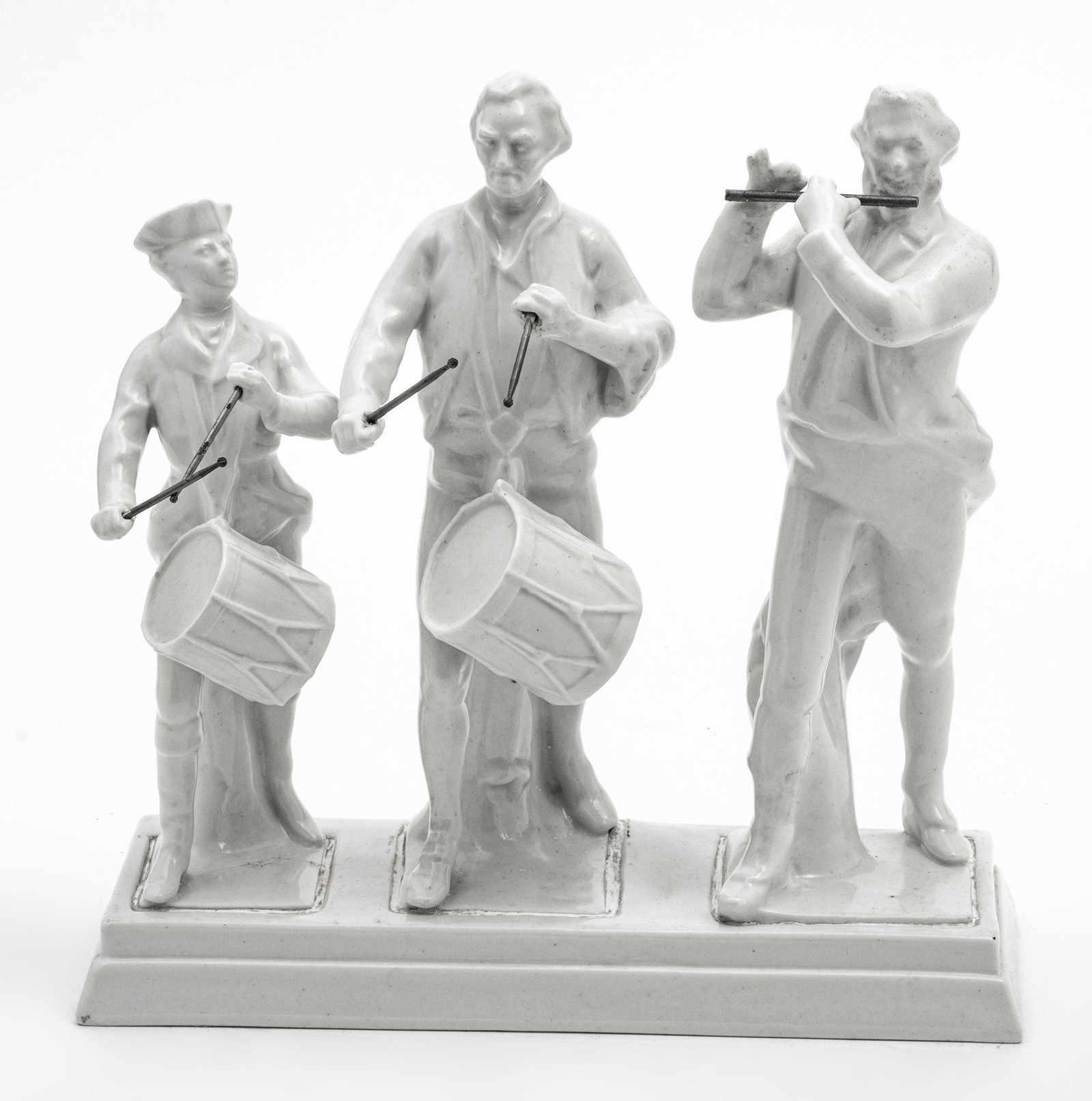 BLANC DE CHINE PORCELAIN SCULPTURE, H 11", L 11", DRUMMERS AND FLUTIST: BLANC DE CHINE PORCELAIN SCULPTURE, H 11", L 11", DRUMMERS AND FLUTIST A blanc de chine porcelain sculpture. Depicting drummers and a flutist. No trademarks. Width 4.5". Provenance: Estate of Joan You