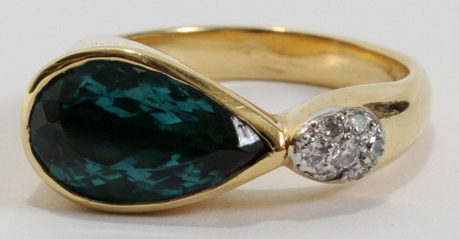 18 KT YELLOW GOLD & TOURMALINE RING W/DIAMONDS: 18 KT YELLOW GOLD & TOURMALINE RING WITH DIAMONDS:Lady's ring consists of 6 diamonds (approximately 0.08 cttw, clarity VS, F-G color) and 1 pear shaped faceted tourmaline, approximately 13mm x 7.5mm x