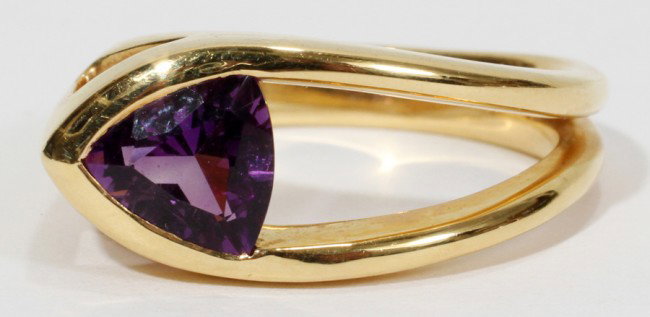 18 KT YELLOW GOLD TRILLIANT CUT AMETHYST RING: 18 KT YELLOW GOLD TRILLIANT CUT AMETHYST RING:Size 6 3/4. weight 9 grams