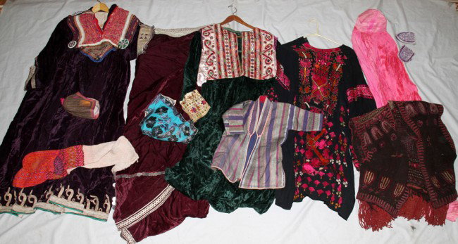 KOCHIAN GARMENTS, 13 PIECES TOTAL: KOCHIAN GARMENTS, 13 PIECES TOTAL:Including a Kochian wedding dress, 48" x 18", & cloak (108" in width when open); one Velvet embroidered dress, 50" x 18"; one full length covering with netted eye hol