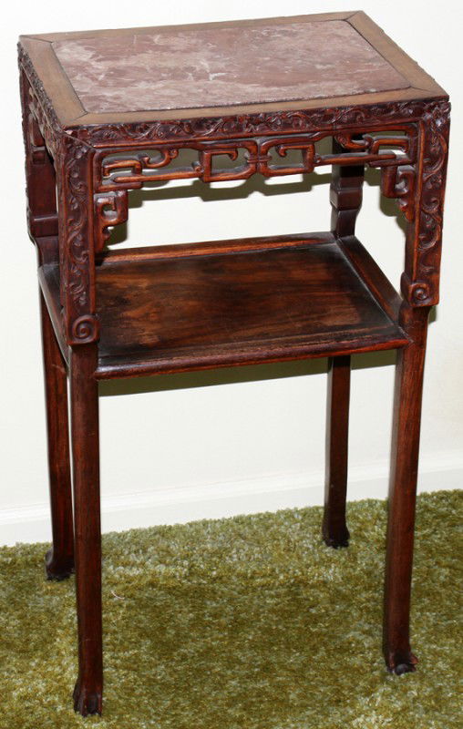 CHINESE TEAKWOOD TABLE, H 31", W 16 3/4", D 12": CHINESE TEAKWOOD TABLE, H 31", W 16 3/4", D 12":Inset marble top, single shelf. Circa 1900. From the Estate of Pearl McKenney, Grosse Pointe Farms.
