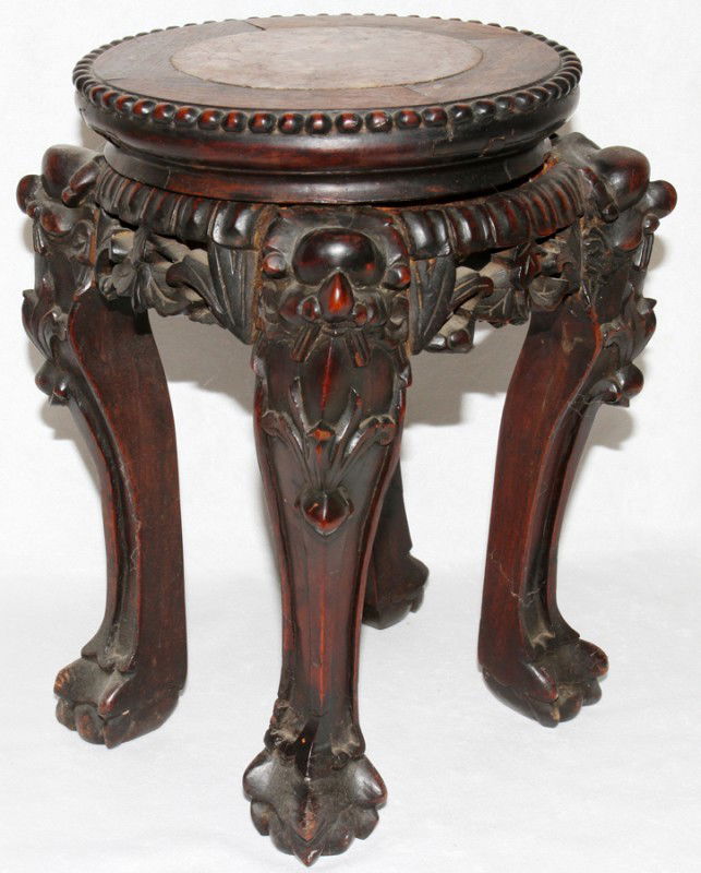 CHINESE TEAKWOOD STAND WITH INSET MARBLE,: CHINESE TEAKWOOD STAND WITH INSET MARBLE, EARLY 20TH C., H 12 3/4", DIA 8 1/2":A round inset marble top with carved supports. From the Estate of Pearl McKenney, Grosse Pointe Farms.
