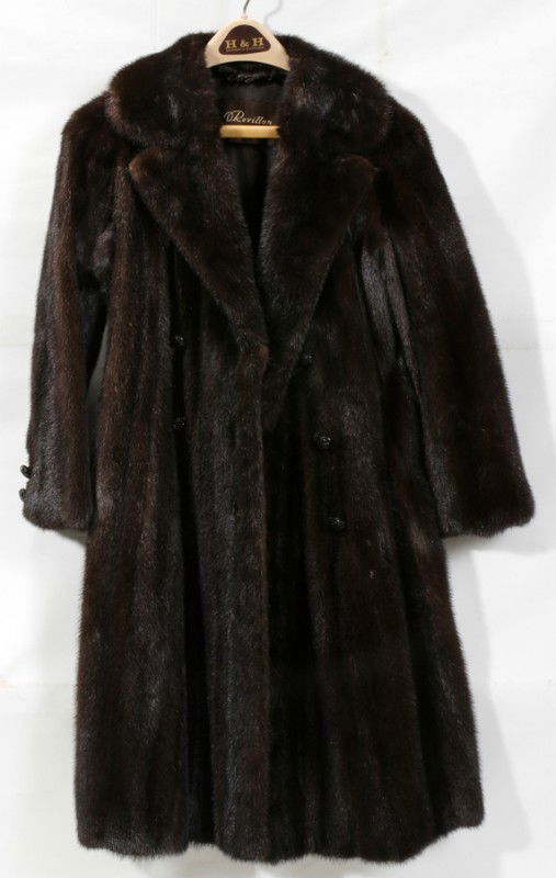 REVILLON BLACK DIAMOND MINK COAT & MINK HAT: REVILLON BLACK DIAMOND MINK DOUBLE-BREASTED COAT & MINK HAT:Retailed by Saks Fifth Avenue, having a notch lapel, three black button closures and cuff button detail, with slit pockets; black silk linin