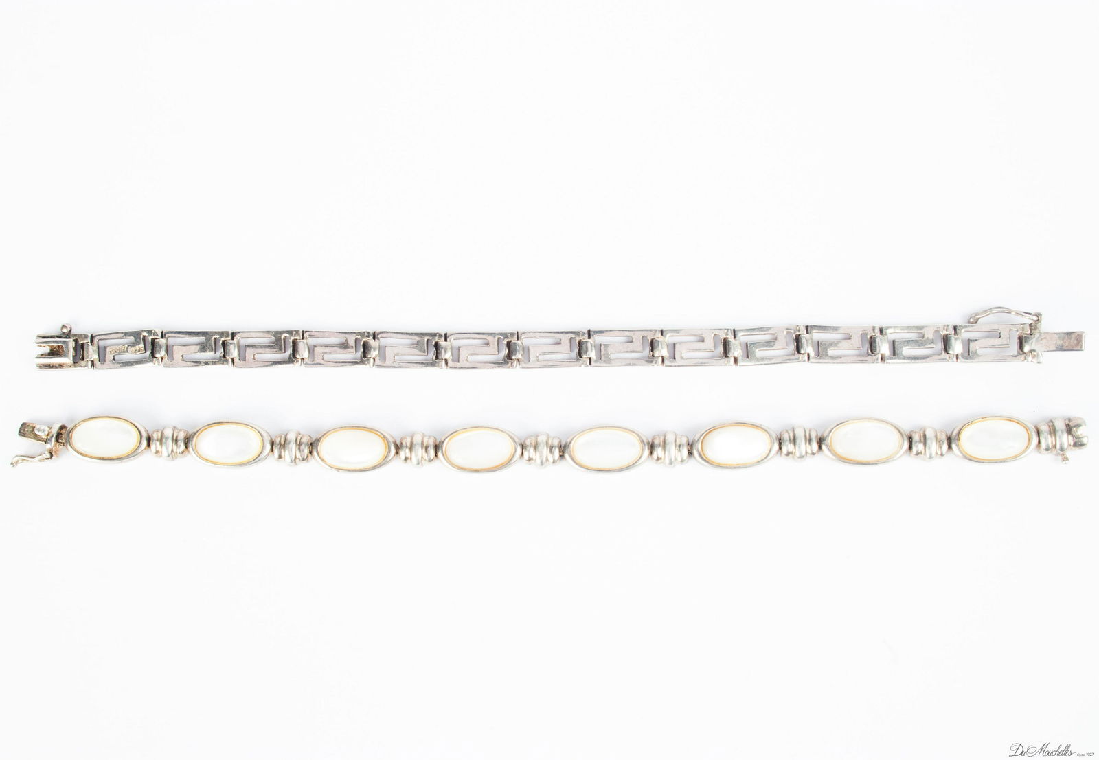 STERLING SILVER LINK BRACELETS C 1950 L 7.2": STERLING SILVER LINK BRACELETS C 1950 L 7.2" One with bezel set 8 moonstones and impressed 925 and mexico. Other in Greek key design. Both impressed 925.
