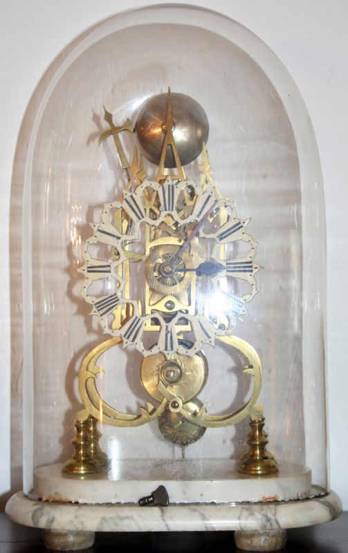 BRASS SKELETON CLOCK UNDER GLASS, C.1850, H 17": BRASS SKELETON CLOCK UNDER GLASS, C.1850, H 17", W 11":Having a brass movement and pendulum and pierced designed face, with black painted Roman numerals; hand blown glass dome; all mounted to a marble