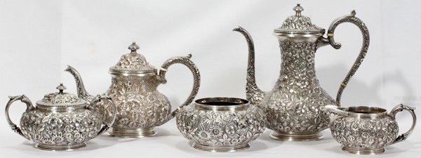 JACOBI & JENKINS STERLING TEA & COFFEE SET,: JACOBI & JENKINS REPOUSSE STERLING TEA & COFFEE SET, C. 1894-1908, FIVE PIECES:A sterling silver set including 1 teapot, H.6 1/2", 1 coffee pot, H.9 1/4", 1 creamer, 1 covered sugar bowl, W.7" (to the