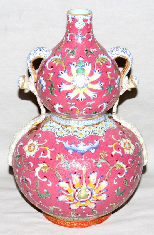 CHINESE FAMILLE ROSE PORCELAIN GOURD FORM VASE,: CHINESE FAMILLE ROSE PORCELAIN GOURD FORM VASE, H 9 1/2", DIA 6":Featuring Ruyi form handles, rose ground with numerous multi colored lotus and bats. Stamped on underside.