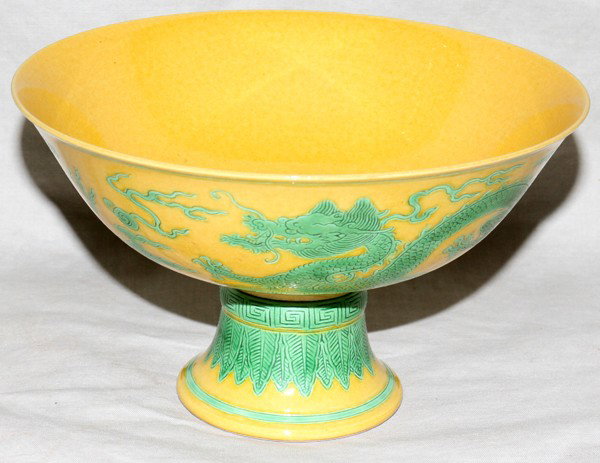 CHINESE PORCELAIN PEDESTAL FORM VASE, H 4 1/4": CHINESE PORCELAIN PEDESTAL FORM VASE, H 4 1/4", DIA 7 1/8":Mustard ground with green dragons, bats and clouds on the exterior and bats on the interior. Characters on underside.