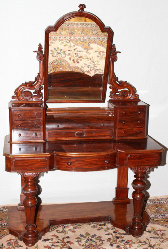 MAHOGANY DRESSING TABLE, C. 1870, H 70", W 48": MAHOGANY DRESSING TABLE, C. 1870, H 70", W 48":Six small drawers, roll top center, a lower drawer and shelf, and hinged mirror. . D 21 1/2"