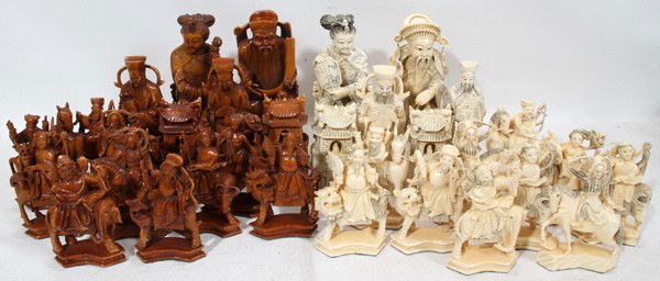 CHINESE CARVED IVORY CHESS SET, 32 PCS ENCASED: CHINESE CARVED IVORY CHESS SET, 32 PIECES ENCASED, H 4" - 8":Large and finely carved ivory figures range in height from approximately 4" to 8" and consists of 16 white figures and 16 tea stained figur