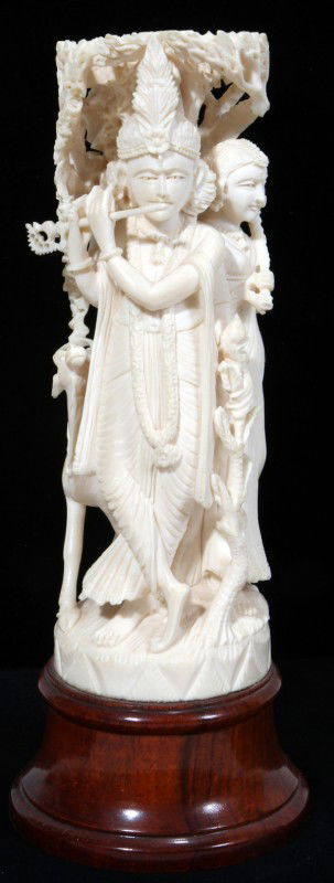 INDIAN CARVED IVORY FIGURE GROUP H 6", DIA 2": INDIAN CARVED IVORY FIGURE GROUP OF KRISHNA & RADHA, H 6", DIA 2":On a wood base, H. 7 3/4" overall. IVORY CAN NOT BE SHIPPED OUTSIDE OF THE CONTINENTAL UNITED STATES.