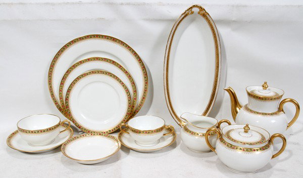 THEODORE HAVILAND LIMOGES DINNER SERVICE, 90 : THEODORE HAVILAND LIMOGES PORCELAIN DINNER SERVICE, 90 PIECES:All are beautifully decorated with a gold rim that is accented by hand painted flowers. Service includes 11 dinner plates, Dia. 10"; 12 te