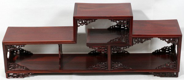 CHINESE TEAK DISPLAY STAND, H 8 1/2", L 22",: CHINESE TEAK DISPLAY STAND, H 8 1/2", L 22", D 4 1/2":Enhanced with carved motifs at the corners and feet.