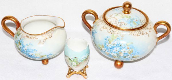 HAVILAND LIMOGES PORCELAIN TOOTHPICK HOLDER,: HAVILAND LIMOGES PORCELAIN TOOTHPICK HOLDER, CREAMER & SUGAR BOWL, H 3" -:Hand painted Limoges porcelain includes 1 creamer and covered sugar bowl and 1 similarly decorated toothpick holder. Height ra