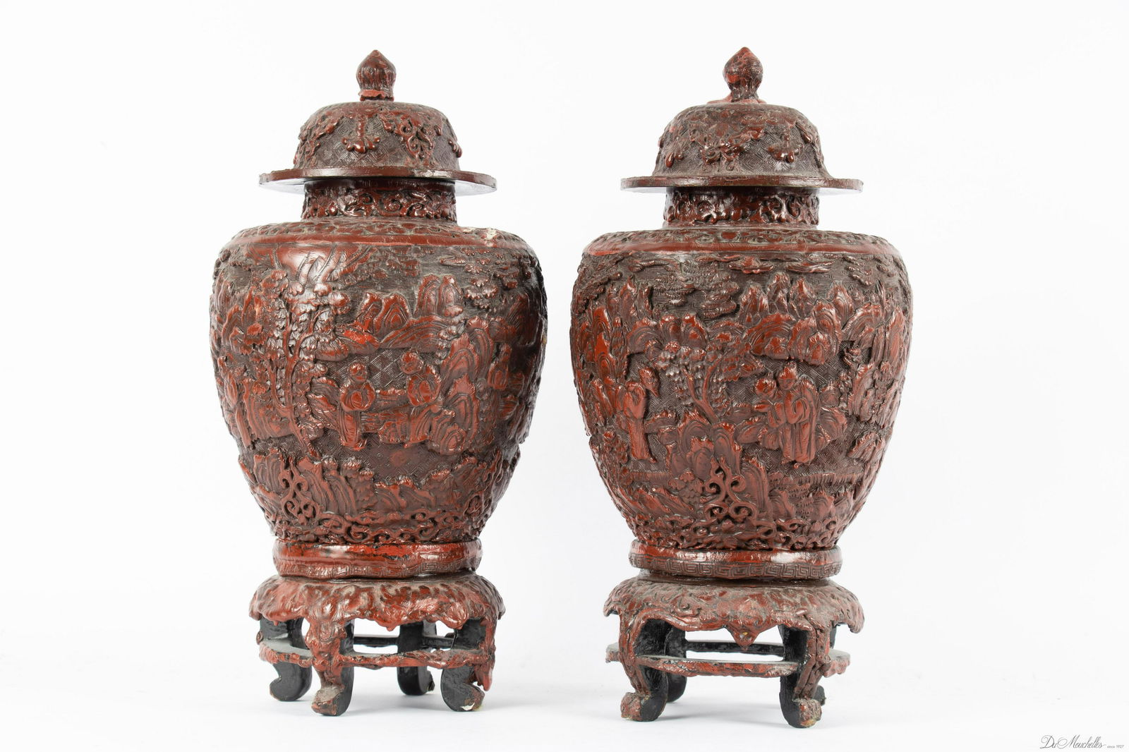 CHINESE CINNABAR STYLE COVERED GINGER JARS, PAIR, H 14", DIA 6.5": CHINESE CINNABAR STYLE COVERED GINGER JARS, PAIR, H 14", DIA 6.5" A pair of Chinese cinnabar style covered ginger jars. Each offers atmospheric motifs rendered in red lacquer. Early to mid-20th centur