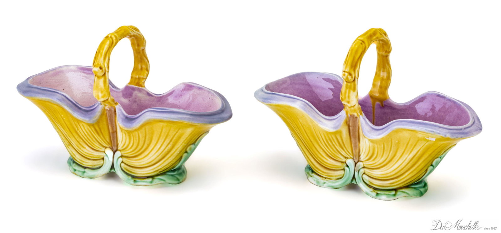 MAJOLICA BASKET FORM VESSELS, C. 1930, PAIR,M H 5", L 7.5": MAJOLICA BASKET FORM VESSELS, C. 1930, PAIR,M H 5", L 7.5" A pair of Majolica basket form vases. Each bearing numerical branding to the undersides. Width 2.75".