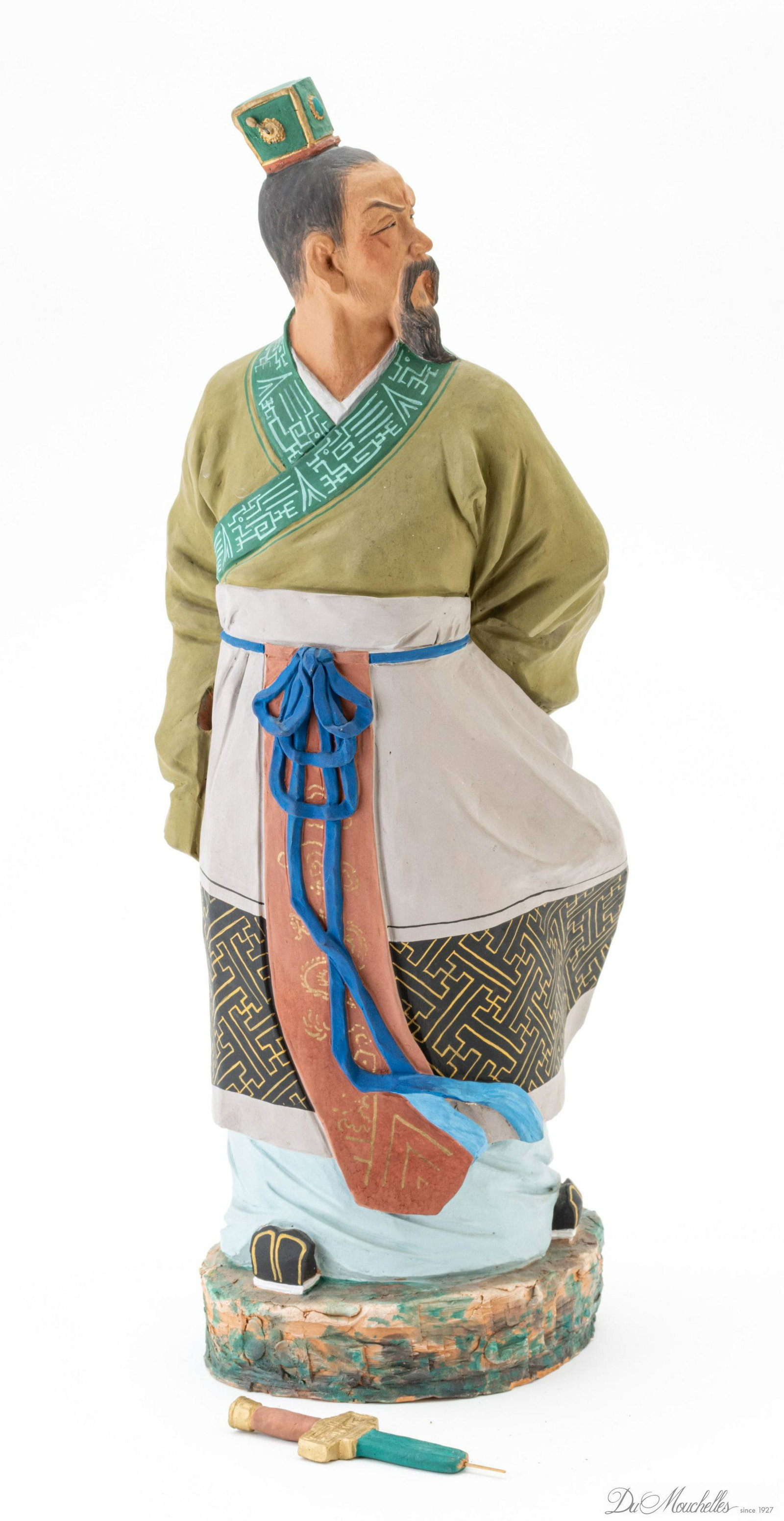 ASIAN POTTERY SCULPTURE WITH SWORD H 23" L 8" D 7": ASIAN POTTERY SCULPTURE WITH SWORD H 23" L 8" D 7" Standing male figure in colorful robes. Character Marks on side.