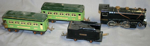LIONEL O-GAUGE TRAIN, FOUR PIECES: LIONEL O-GAUGE TRAIN, FOUR PIECES:includes: one Lionel 2-4-0 Steam locomotive, one Lionel Lines tender, two, #607 and #608 Pullman cars, each having light green bodies with dark green roofs;