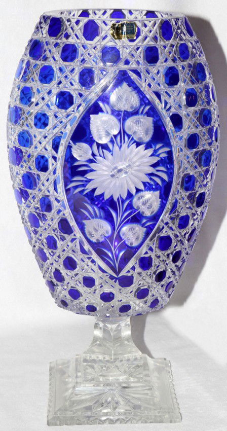 GERMAN COBALT CUT-TO-CLEAR VASE, H 14", W 8": GERMAN COBALT CUT-TO-CLEAR VASE, H 14", W 8":Ovoid shape with cobalt blue overlay, cut to clear with a floral reserve and cane pattern, on a clear stepped base; etched signature at the base.