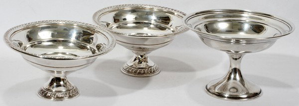 GORHAM & AMC STERLING WEIGHTED COMPOTES, 3, H 3: GORHAM & AMC STERLING WEIGHTED COMPOTES, THREE, H 3":The Gorham compote is H 3 7/8" marked Gorham Sterling 142 with an "R" monogram while the pair of AMC compotes are H 3". Each compote is weighted.
