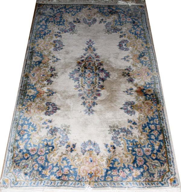 KERMAN ORIENTAL RUG, 5' 0" X 3' 0": KERMAN ORIENTAL RUG, 5' 0" X 3' 0":Beige ground with central medallion, floral and leaf borders. From the collection of Joseph and Norina Simon, Grosse Pointe Farms, Mi.