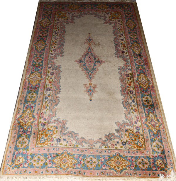 KERMAN PERSIAN WOOL RUG, 6' 11" X 3' 10": KERMAN PERSIAN WOOL RUG, 6' 11" X 3' 10":Beige background, center medallion with floral and leaf design in the border. From the collection of Joseph and Norina Simon, Grosse Pointe Farms, Mi.