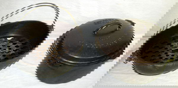 WAGNER WARE, CAST IRON "DRIP DROP" ROASTER: WAGNER WARE SIDNEY, OHIO CAST IRON "DRIP DROP" ROASTER & ROUND ROASTER 1 INTERCHANGEABLE LID C.1920:+ wire trivet; 8" H. x 13" Dia.