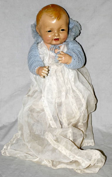 EFFANBEE COMPOSITION & CLOTH DOLL, 'BUBBLES': EFFANBEE COMPOSITION & CLOTH BABY DOLL, 'BUBBLES', C. 1924, L 19":Composition head with molded hair, sleep eyes and open mouth, cloth body with composition arms. The back plate molded with 1924 and co