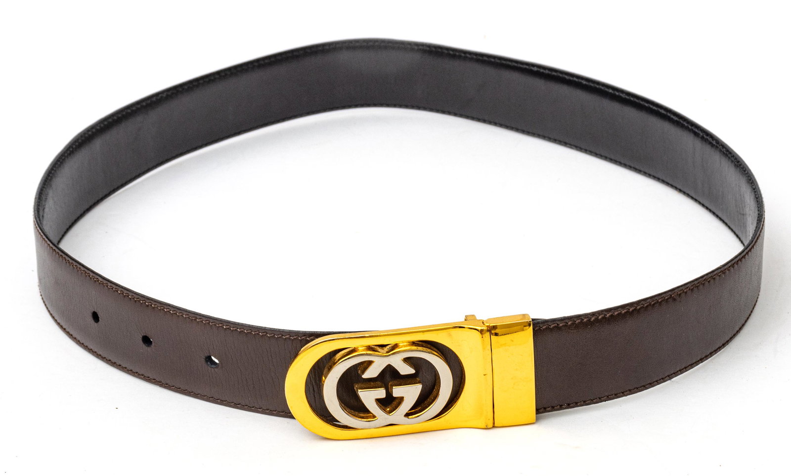 GUCCI (CO.) (ITALIAN, 1921) VINTAGE BROWN LEATHER BELT WITH GOLD PLATED HARDWARE, L 32.75": GUCCI (CO.) (ITALIAN, 1921) VINTAGE BROWN LEATHER BELT WITH GOLD PLATED HARDWARE, L 32.75" A vintage Gucci brown leather belt. Offers a gold tone and silver tone metal fastener. Width 1 1/8". Bearing 