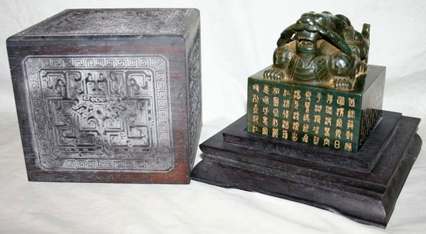 CHINESE JADE SEAL, H 4 1/2", L 4 1/8", D 4 1/8": CHINESE JADE SEAL, H 4 1/2", L 4 1/8", D 4 1/8":Featuring a horned dragon atop with a poem written in Chinese and Mongolian characters. Qianlong mark. Accompanied by a carved and fitted covered box.