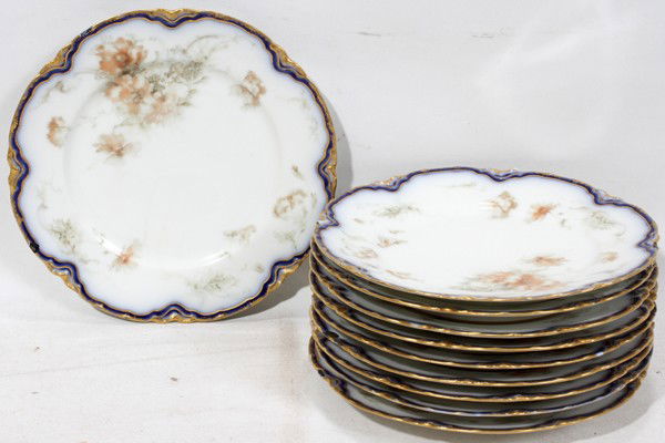 HAVILAND 'FEU DE FOUR' PORCELAIN PLATES, 10,: HAVILAND 'FEU DE FOUR' PORCELAIN PLATES, SET OF TEN, DIA 7 1/4":Cobalt blue border, fired gold edge. Five are signed by artist "Crocker".