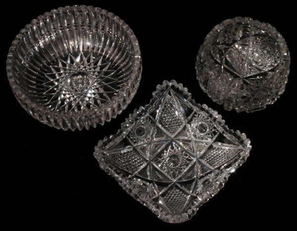 CUT GLASS BOWL, DIA 6", & 2 OTHER BOWLS: CUT GLASS BOWL, H 2 1/2", DIA 6", & TWO OTHER BOWLS:A round bowl with a star-cut base and spear and notched cuts about the exterior, not signed, H.2 1/2", Dia.6". Together with 1 cut glass sugar bowl,