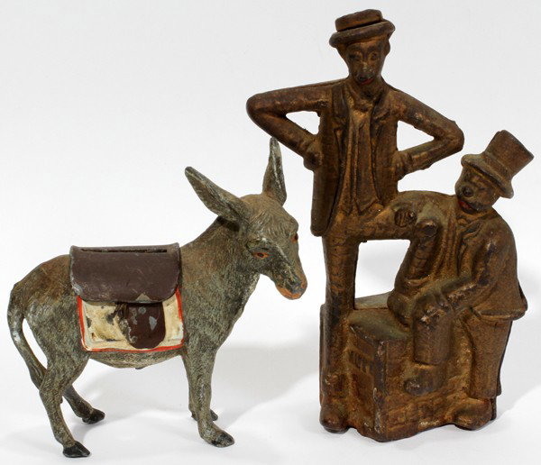 MUTT & JEFF" STILL BANK CAST IRON 5.25" & BANK: MUTT & JEFF" STILL BANK CAST IRON 5.25" AND DONKEY IRON BANK:Mutt and Jef still bank: Minor traces of paint on lips. Circa 1900. Moore #157. Donkey still bank in cast iron with hinged saddle: H 3.5" m