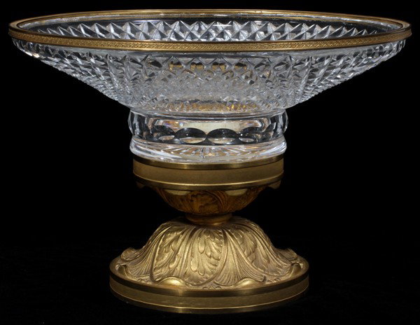 CRYSTAL & D'ORE BRONZE CENTERPIECE 20TH C, H 8": FRENCH STYLE CRYSTAL & D'ORE BRONZE CENTERPIECE, 20TH CENTURY, H 8", D 12":Diamond point cut crystal with a star in the bottom; foliate motif on the bronze pedestal foot; 20th c. Actual height is 8 1/