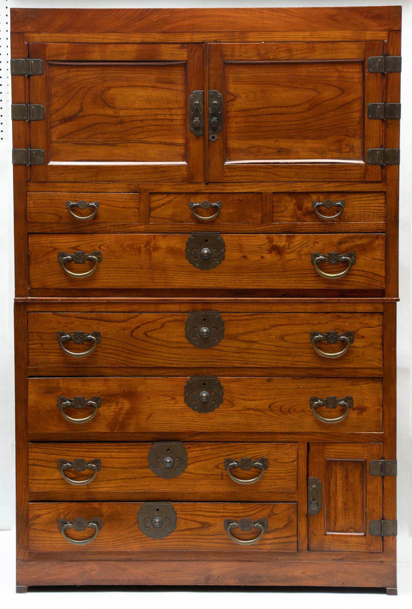 KOREAN CARVED WOOD CHEST-ON-CHEST, H 68 1/2", L 45 1/2", D 20 1/2": KOREAN CARVED WOOD CHEST-ON-CHEST, H 68 1/2", L 45 1/2", D 20 1/2" Brass hardware. Two upper wood paneled doors above three smaller drawers. Three full sized drawers above two three quarter length dra