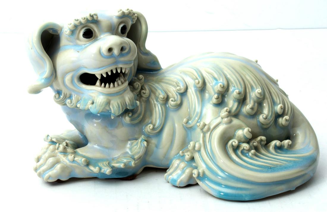 CHINESE PORCELAIN FOO DOG, ONE H 5 1/2" L 9.5": CHINESE PORCELAIN FOO DOG, ONE H 5 1/2" L 9.5" Unusual sitting position. Good definition in teeth, eyes, paws. Glazed earthenware.