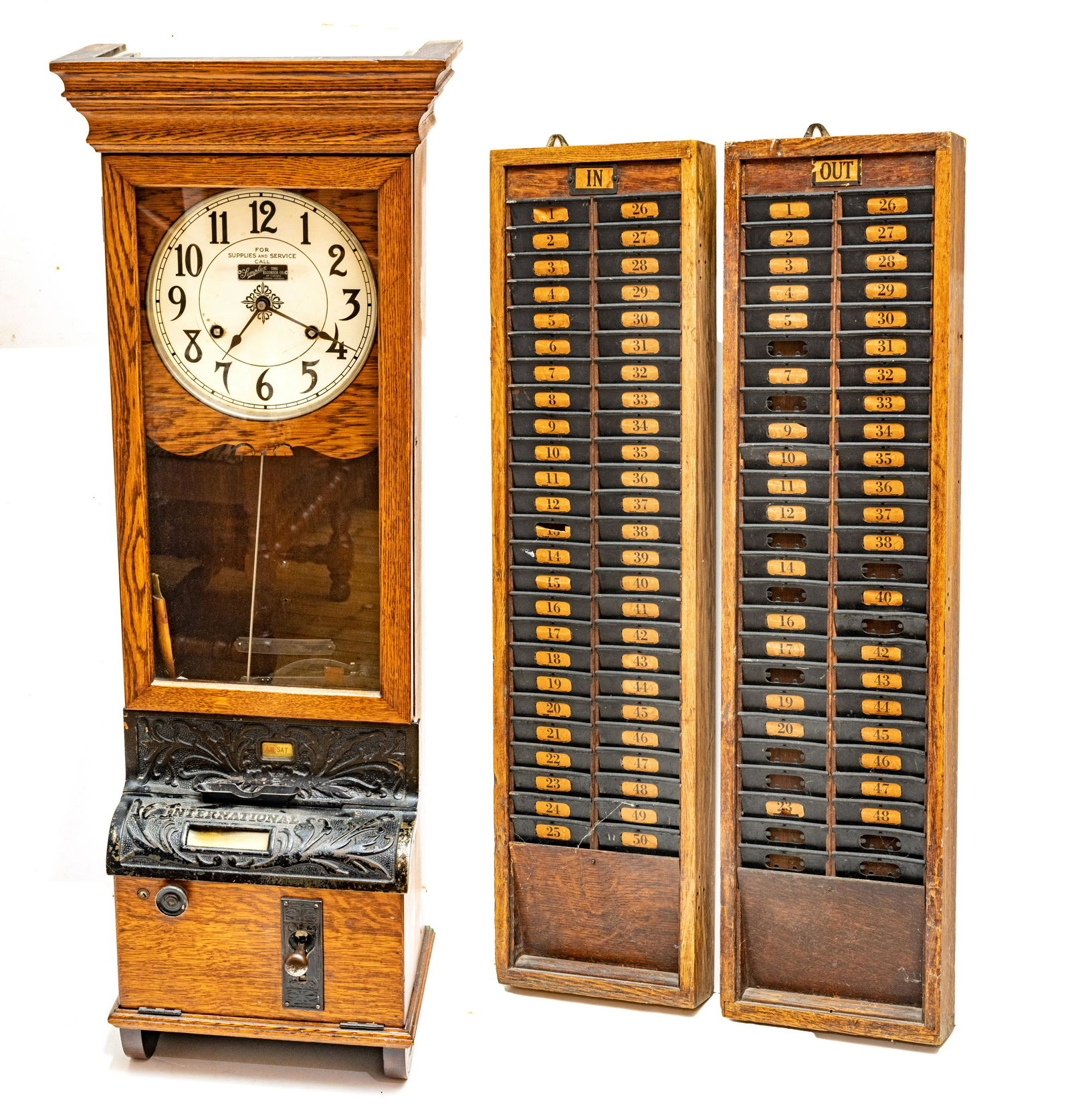 INTERNATIONAL DIST. BY SIMPLEX TIME RECORDER COMPANY (LONDON, ONTARIO) OAK CASE PUNCH CLOCK AND TIME: INTERNATIONAL DIST. BY SIMPLEX TIME RECORDER COMPANY (LONDON, ONTARIO) OAK CASE PUNCH CLOCK AND TIMECARD RACKS, 20TH C., THREE PIECES, H 47", W 16.5", D 10.25" (CLOCK) Oak case punch clock manufacture