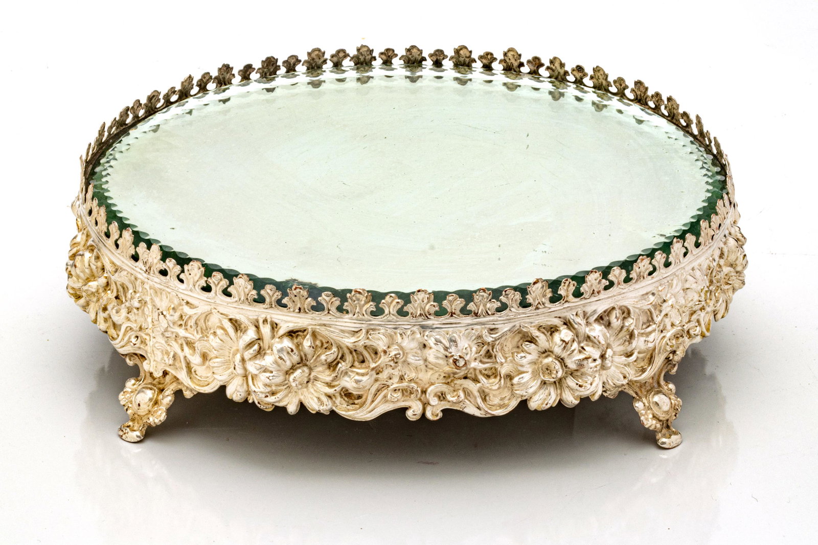 SILVER PLATE PLATEAU MIRROR, CIRCA 1900 H 3" DIA 10": SILVER PLATE PLATEAU MIRROR, CIRCA 1900 H 3" DIA 10" Footed. Repousse frame.